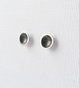 Domed ear studs with black centre