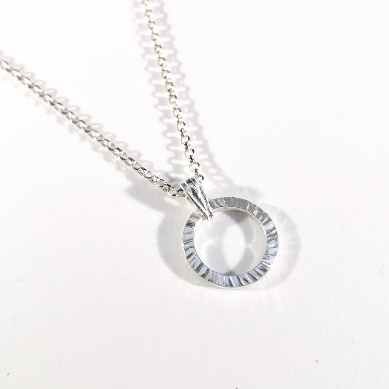 Silver circle necklace with texture